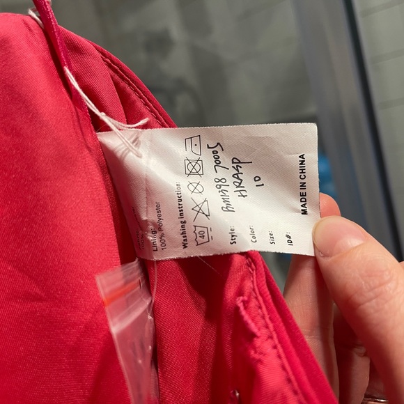 Dress never worn. 

Color: bright pink. 

Comes with removable straps. - Picture 6 of 6